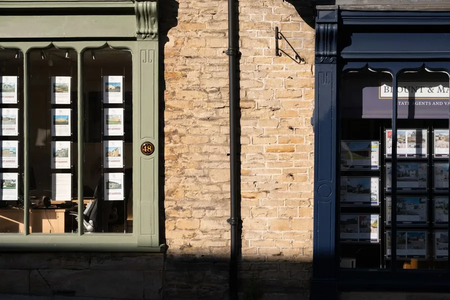 Property listings in an estate agent's window