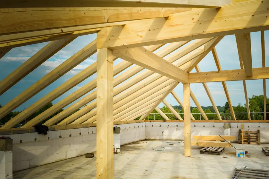 Roof timbers and rafters exposed during roof construction work
