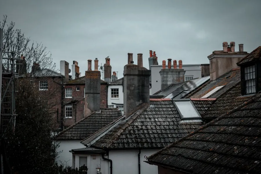 Croydon rooftops and chimneys under an overcast sky at the end of summer