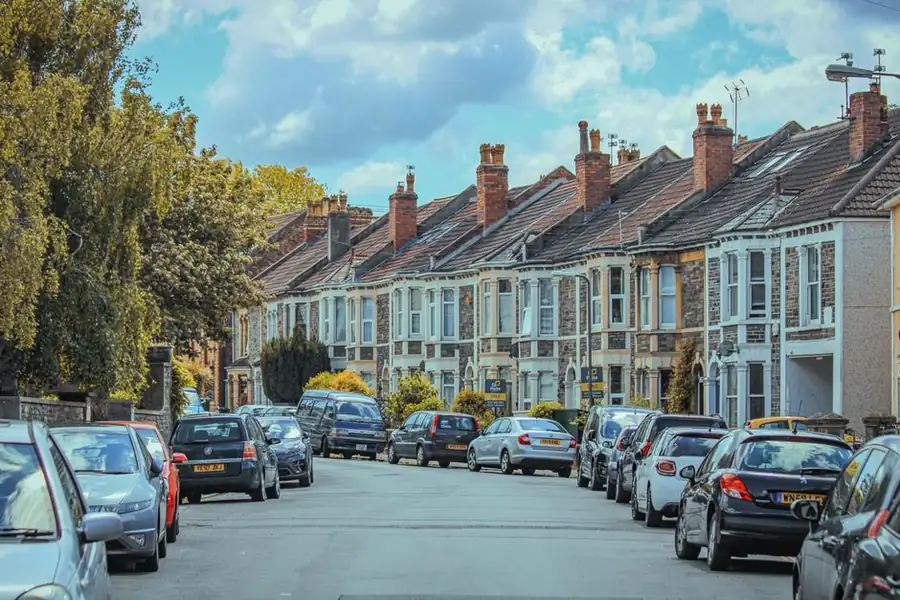 Rows of terraced roofs and chimney stacks in Croydon where flats share a single roof structure