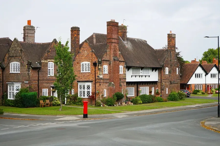 Victorian brick cottages with clay tiled roofs on a street corner in a conservation area