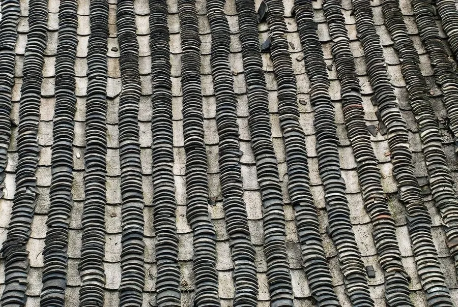 Close detail of an aged slate roof covering in Croydon