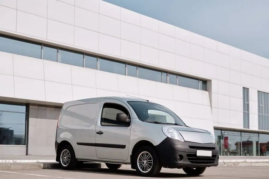 A tradesman's work van parked on a street