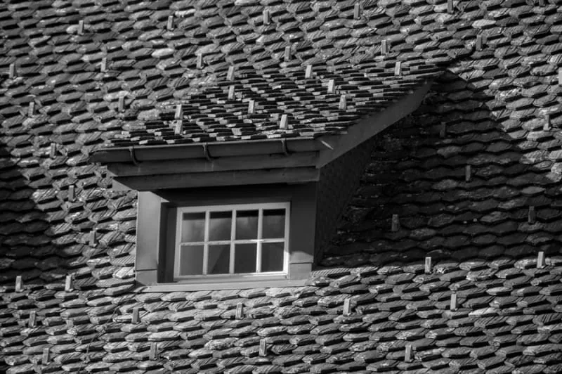 Dormer window on a tiled roof in Croydon showing the roofline detail