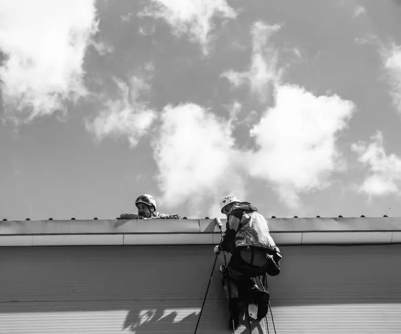 Roofers working on a roof in Croydon